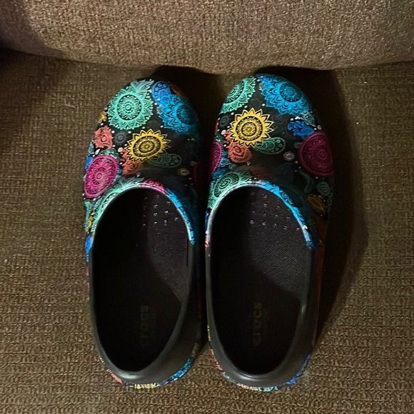 CROCS Shoes - Color black with multi color on them, size 6 Brand new.